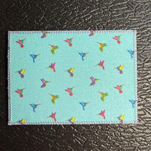 Tiny Hummingbirds on Teal