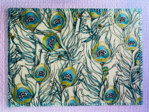 Metallic Peacock Feathers on Sage