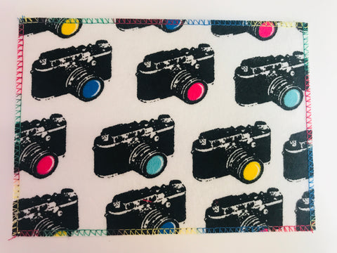 Cameras on White Flannel